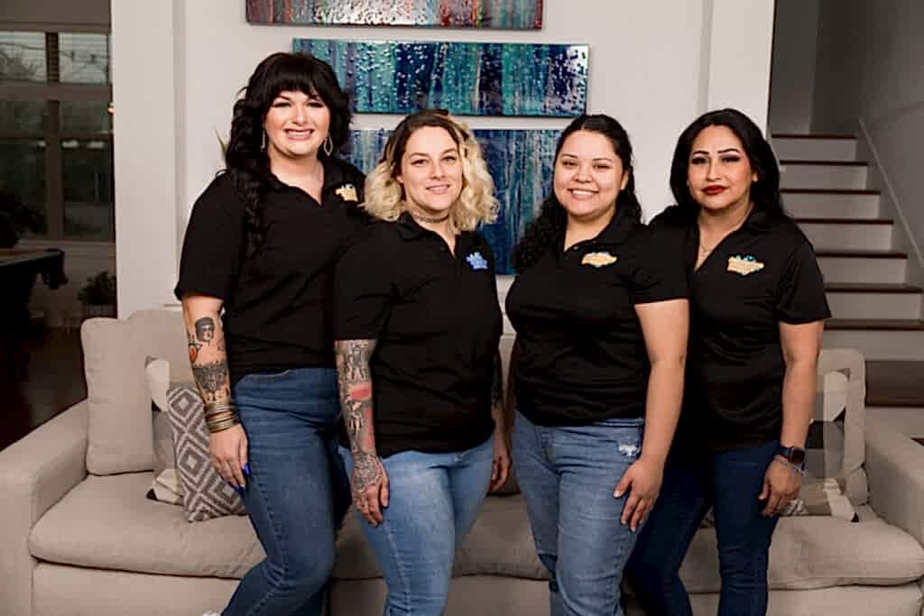 Home clean home - Naturalcare Cleaning Service staff pose for a group photo after cleaning a Houston home until it sparkles.