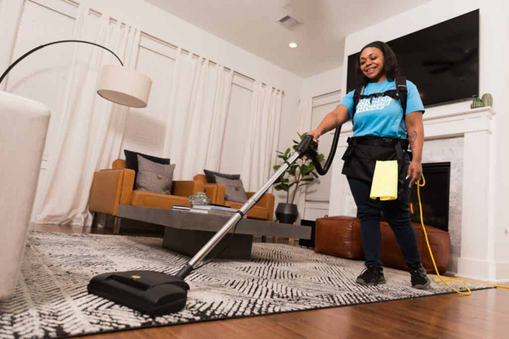 Naturalcare Cleaning Service staff ensuring an area rug is clean so that their clients can enjoy a sweet home clean home.