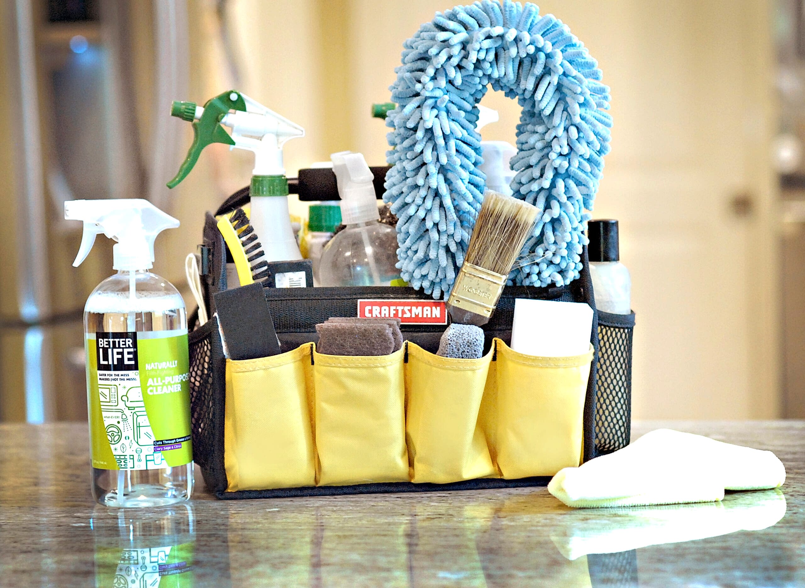 Naturalcare eco friendly cleaning products in a basket on a counter.