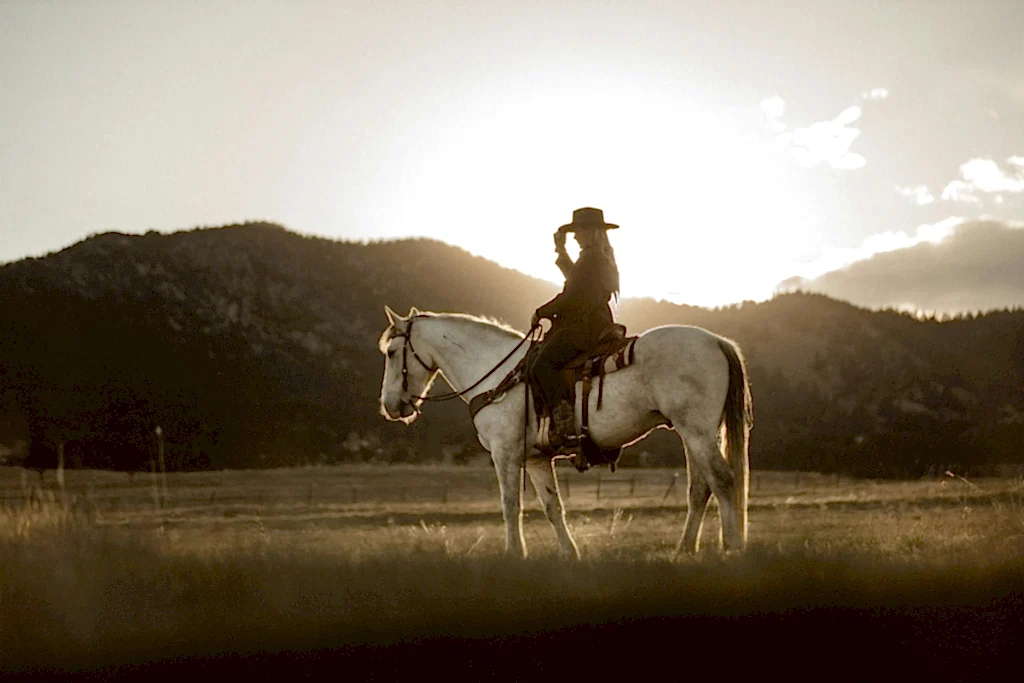 A woman riding a horse near Cinco Ranch.